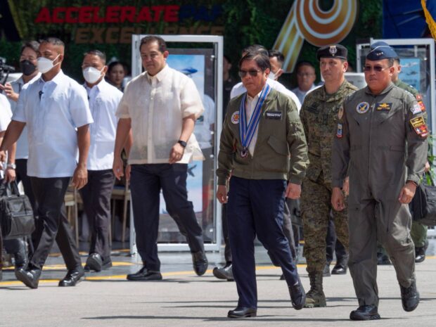 Speaker Ferdinand Martin G. Romualdez arrives with President Ferdinand R. Marcos, Jr. at the Haribon Hangar in Clark Air Base at Mabalacat, Pampanga Monday morning to grace the celebration of the 76th founding anniversary of the Philippine Air Force. Accompanying them is PAF Commanding General, Lt. Gen. Stephen Parreno (right).