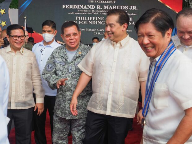 Speaker Ferdinand Martin G. Romualdez and House Majority Leader Manuel Jose “Mannix” Dalipe (left) share a light moment with President Ferdinand R. Marcos, Jr. when they met as the Chief Executive leaves the Haribon Hangar in Clark Air Base, Mabalacat, Pampanga where the rites for the 76th founding anniversary of the Philippine Air Force was held Monday morning.