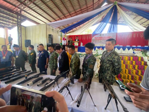 Police and military personnel document the 36 assorted high-powered guns surrendered by civilians in 34 villages of Datu Odin Sinsuat, Maguindanao del Norte. (Photo from 6th ID)