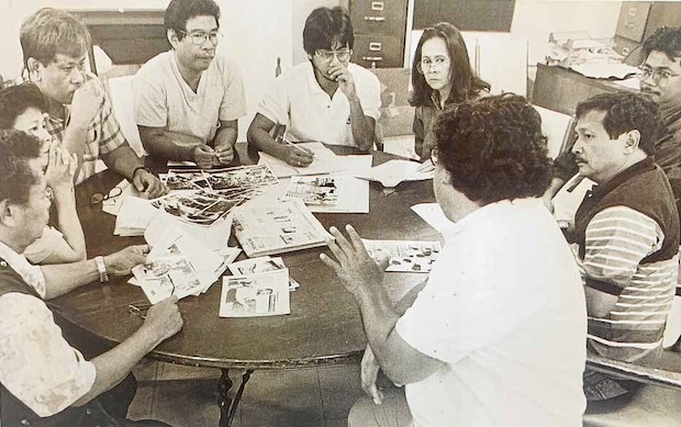 Inquirer editors in the early ’90s met and discussed the next day’s headlines on a round dining table (bottom) that followed the paper through three decades of transfer into several offices. 
