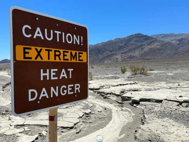 A view of sign board warning of extreme heat in Death Valley, California, U.S. July 15, 2023. REUTERS/Jorge Garcia/File Photo