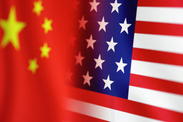 U.S. and Chinese flags are seen in this illustration taken, January 30, 2023. REUTERS/Dado Ruvic/Illustration/File Photo