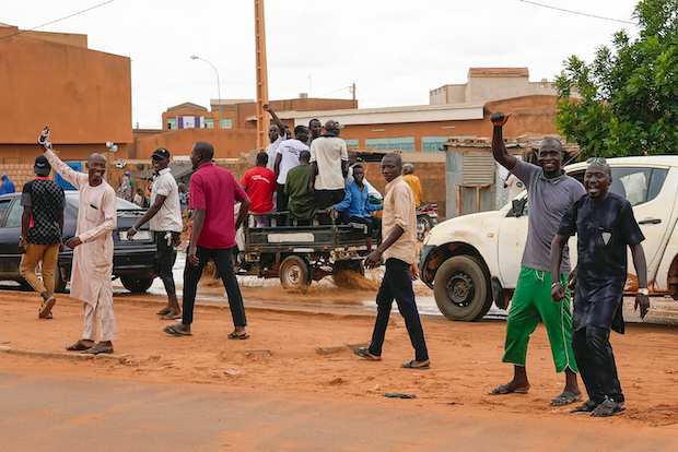 Nigerien men gather for an anti-French protest in Niamey, Nige