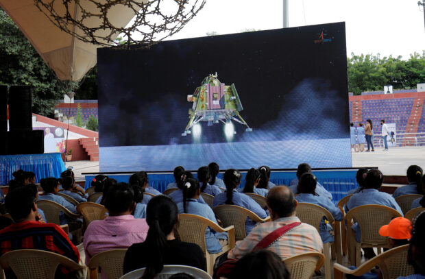 People watch a live stream of Chandrayaan-3 spacecraft's landing on the moon, inside an auditorium of Gujarat Science City in Ahmedabad, India, August 23, 2023. REUTERS/Amit Dave
