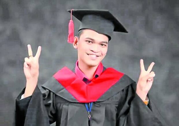 OVERCOMING ODDS Rico Palconit, who has been bullied because of his cleft lip, poses for a graduation photo to mark his completion of an information technology degree, magna cum laude, at AMA Computer Learning Center in Tacloban City. 