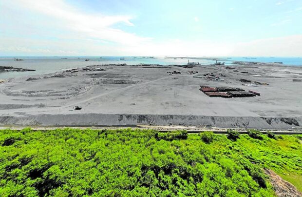 The reclamation site in Manila Bay along Diokno Boulevard in Pasay City looks desolate on Monday, Aug. 14, 2023, after the government suspended all reclamation activities in the bay.