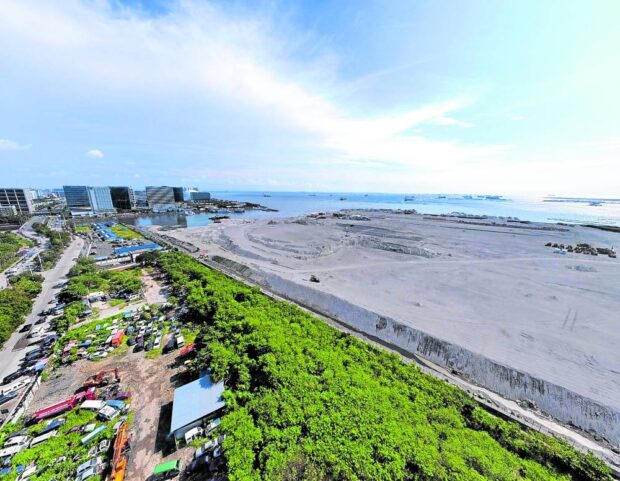 LAND MEETS LAND This photo taken on Monday shows how this portion of Manila Bay along J.W. Diokno Boulevard in Pasay City has changed due to reclamation activities. President Marcos has suspended all reclamation projects in Manila Bay pending review of processes that went into their approval and their environmental impact. —GRIG C. MONTEGRANDE