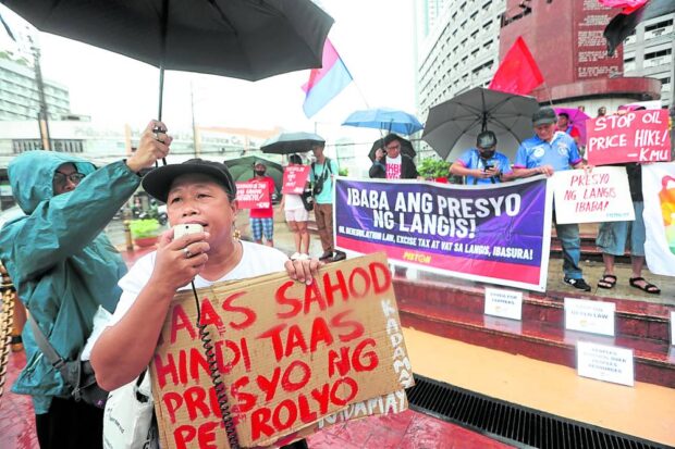 Workers rally in Quezon City seeking a wage hike due to increased prices.
