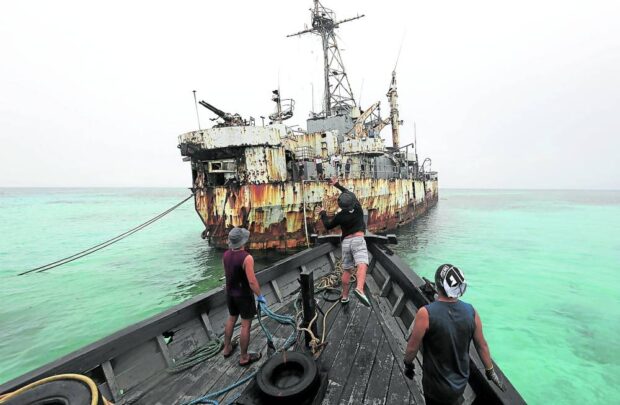 Members of a resupply mission prepare to embark the grounded naval ship BRP Sierra Madre at Ayungin (Second Thomas) Shoal, one of the nine outposts guarding the West Philippine Sea, to replenish supplies for its troops. (INQUIRER FILE PHOTO)