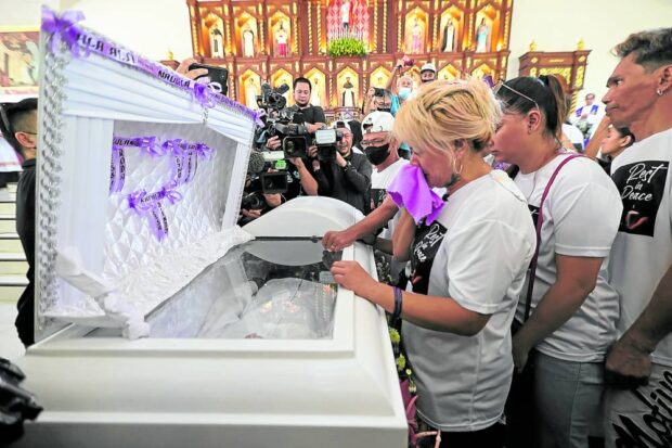 PHOTO: Rodaliza Baltazar, the OFW mother of slain teenager Jerhode “Jemboy” Baltazar, bids her last farewell to her son during a funeral mass at the San Lorenzo Parish in Navotas City on Wednesday, August 16, 2023. STORY: 8 cops in Jemboy Baltazar killing case appeals dismissal from service