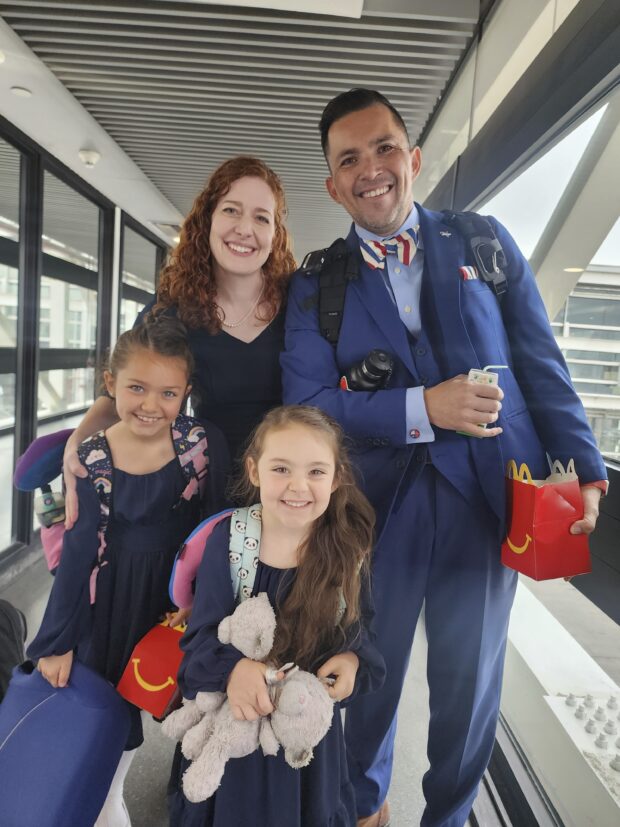 Jimmy Thyden poses for a photo with his wife Johannah, and their two daughters, Ebba Joy, 8, left, and Betty Grace, 5, center, at the Valdivia Airport in Valdivia, Chile. 