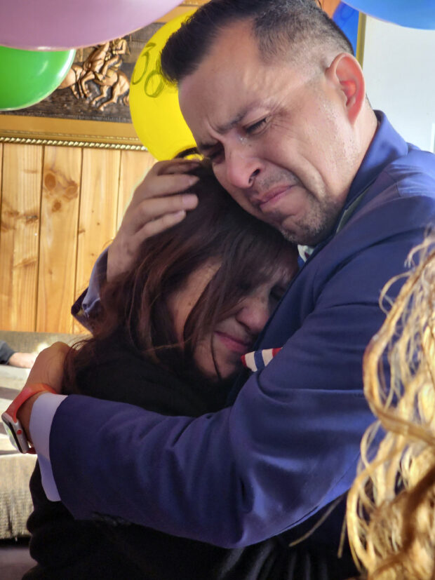 In this image provided by Constanza Del Rio/Nos Buscamos, Jimmy Thyden, right, hugs Maria Angelica Gonzalez, his Chilean birth mother, as they meet for the first time in Valdivia, Chile on Thursday, Aug. 17, 2023.