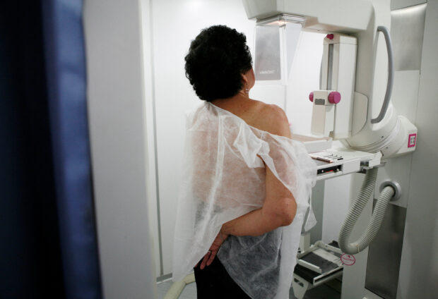 FILE PHOTO: A woman undergoes a free mammogram inside Peru's first mobile unit for breast cancer detection, in Lima