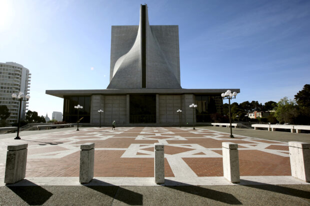 A pedestrian walks across the plaza at St. Mary's Cathedral in San Francisco