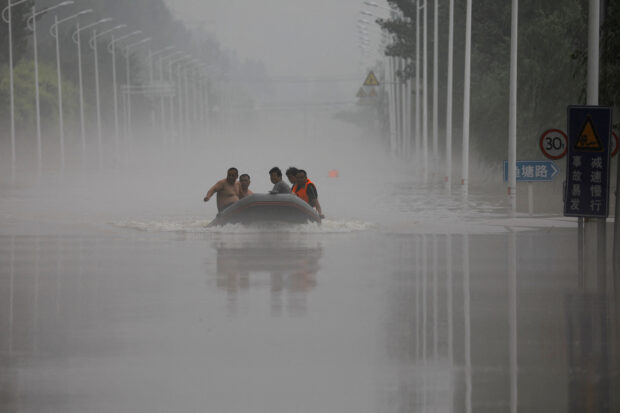 China floodwater diversions to populated areas