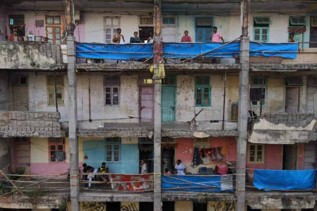 The Wider Image: Some Mumbai residents risk safety for affordable, central housing