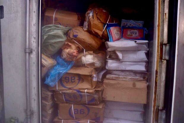 Authorities seized an estimated P30 million worth of expired frozen meat and meat products from China and Germany during a raid on an illegal storage facility in Caloocan City.