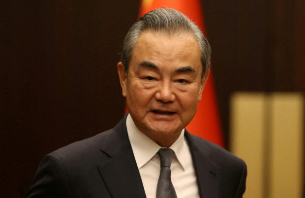 FILE PHOTO: China's Wang Yi makes first statement after reappointment as foreign minister