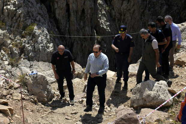 Turkish governor of Mersin, Ali Hamza Pehlivan, front center, during his visit to the Morca cave during a rescue operation near Anamur, south Turkey, Saturday, Sept. 9, 2023. American researcher Mark Dickey, 40, who fell ill almost 1,000 meters (more than 3,000 feet) below the entrance of a cave in Turkey, has recovered sufficiently enough to be extracted in an operation that could last three or four days. 