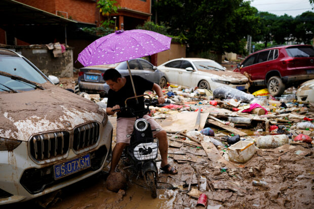 Incessant rain in China causes over 100 landslides and traps residents in floodwaters