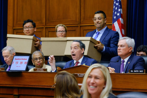 House Oversight Committee Ranking Member Rep. Jamie Raskin (D-MD) speaks as his aides hold boxes of what he said were thousands of pages of Biden family bank records subpoenaed by the committee as Chairman James Comer (R-KY) looks on during a House Oversight and Accountability Committee impeachment inquiry hearing into U.S. President Joe Biden, focused on his son Hunter Biden's foreign business dealings, on Capitol Hill in Washington, U.S., September 28, 2023.  REUTERS/Jim Bourg