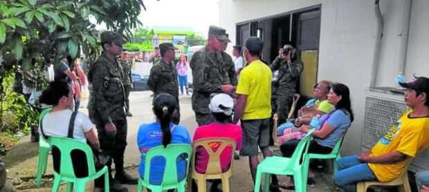 Maj. Gen. Roberto Capulong, commander of the Army’s 2nd Infantry Division handling anti-insurgency operations in Calabarzon, condoles with and provides financial aid to the families of the five militiamen who were killed by suspected communist rebels in Tagkawayan, Quezon, on Sept. 1, 2023.