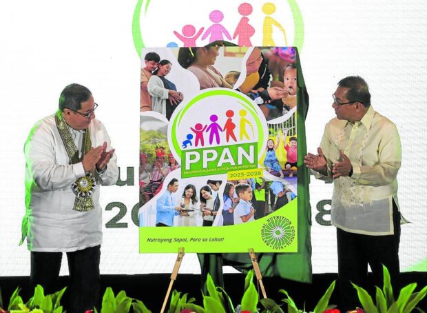 National Nutrition Council (NNC) Board Chair and Health Secretary Teodoro Herbosa with Science and Technology Secretary and NNC member Renato Solidum Jr. unveil the “Philippine Plan of Action for Nutrition 2023 - 2028” during its national launching at Manila Hotel in Manila. It will serve as the country’s blueprint of action for nutrition improvement and will set targets and priority actions to guide national government agencies, local governments and other stakeholders.
