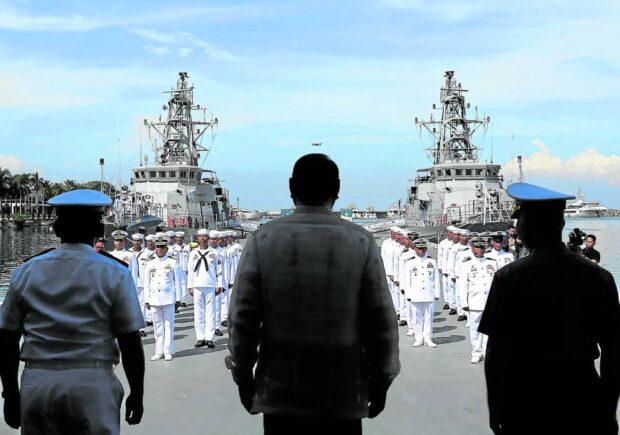 NAVAL ASSETS Defense Secretary Gilberto Teodoro Jr. (center) leads the commissioning ceremony for two patrol ships donated by the United States—BRP Valentin Diaz (PS-177) and BRP Ladislao Diwa (PS-178)—at the Philippine Navy headquarters in Manila on Monday. —RICHARD A. REYES