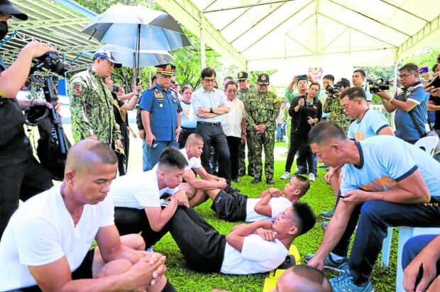 FITNESS TEST Interior Secretary Benhur Abalos and top officialsof the Philippine National Police check on the selection process for the second batch of police recruits from former Moro rebel groups at Camp Salipada K. Pendatun in Parang, Maguindanao del Norte, on Wednesday. —PHOTO COURTESY OF BARMM POLICE OFFICE