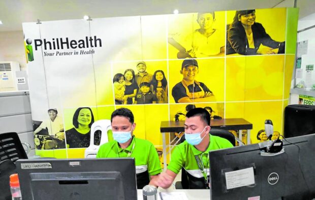 Photo of PhilHealth office in Region XI with a tarpaulin sign carrying the PhilHealth logo iin the background.