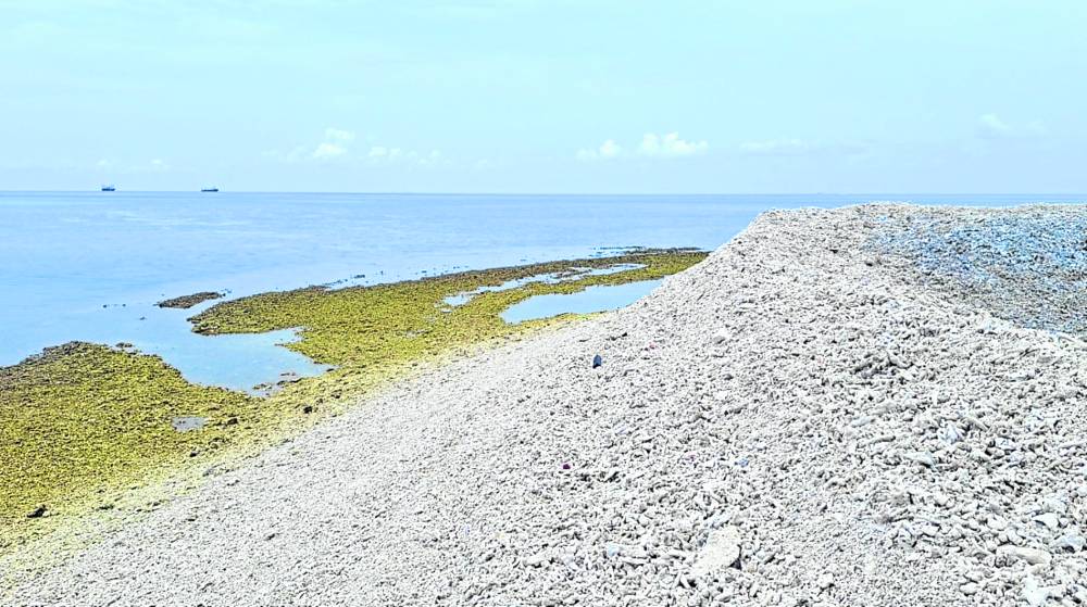 PRELUDE TO RECLAMATION?  A portion of Sandy Cay 2 off Pag-asa Island in the West Philippine Sea is now covered with dead, crushed corals in this photo taken on Sept. 22-  —GERALDFORD TICKE