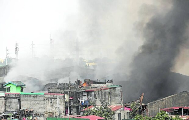VALENZUELA BLAZE The fire that started at the warehouse of Herco Trading Inc. in Bagbaguin, Canumay East, Valenzuela City, has been raging for more than 24 hours when this photo was taken on Friday. A mass evacuation ensued in the surrounding neighborhood. —LYN RILLON