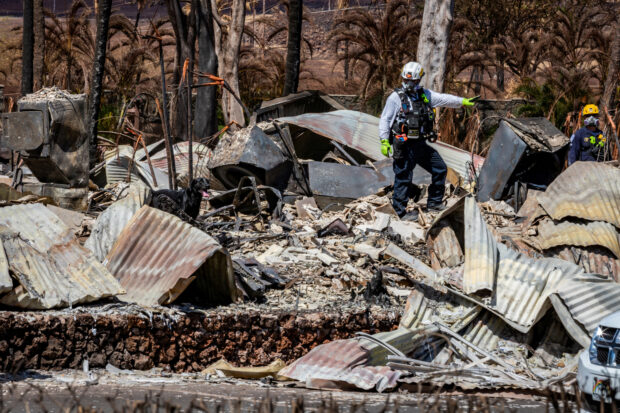 FILE PHOTO: Search, rescue and recovery personnel conduct search operations of areas damaged by Maui wildfires