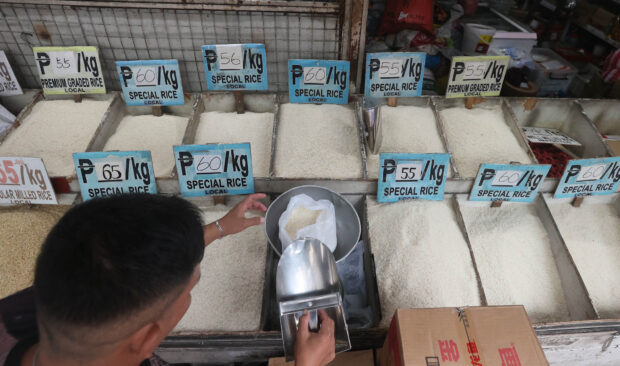 MONITORING Rice prices in Cartimar, Pasay City, on the eve of the price ceiling which takes effect today. —MARIANNE BERMUDEZ       price cap