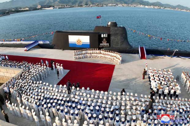 A view of what state media report was a launching ceremony for a new tactical nuclear attack submarine in North Korea.