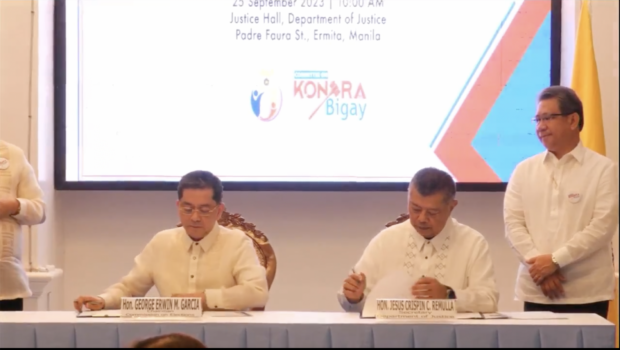 The Commission on Elections and Department of Justice sign an agreement formalizing the creation of the "Kontra-Bigay committee" against vote-buying and selling in a ceremony held on Monday, September 25. 