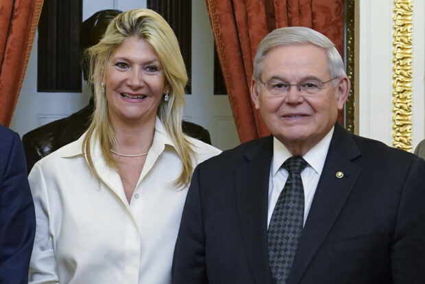 enate Foreign Relations Committee Chairman, Sen. Bob Menendez, D-N.J., right, and his wife Nadine Arslanian, pose for a photo on Capitol Hill in Washington, Dec. 20, 2022. 