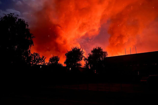 In this handout photograph taken and released by Ukrainian Emergency Service on October 1, 2023 smoke rises above an industrial facility following a drone attack in Uman, Cherkasy region. (Photo by Handout / UKRAINIAN EMERGENCY SERVICE / AFP) / RESTRICTED TO EDITORIAL USE - MANDATORY CREDIT "AFP PHOTO / HO / UKRAINIAN EMERGENCY SERVICE" - NO MARKETING NO ADVERTISING CAMPAIGNS - DISTRIBUTED AS A SERVICE TO CLIENTS