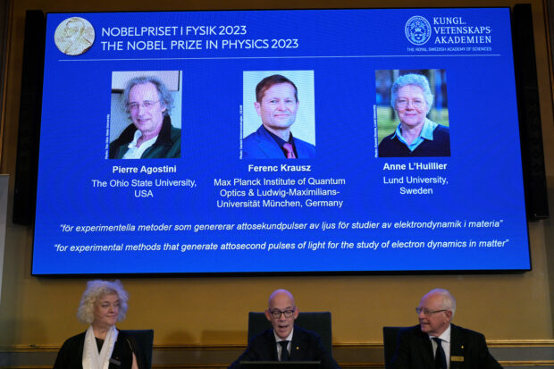 Hans Ellegren, permanent secretary of the Royal Academy of Sciences, flanked by Eva Olsson and Mats Larsson, members, announces this year's Nobel Prize winners in Physics, at the Royal Academy of Sciences in Stockholm, Sweden October 3, 2023.