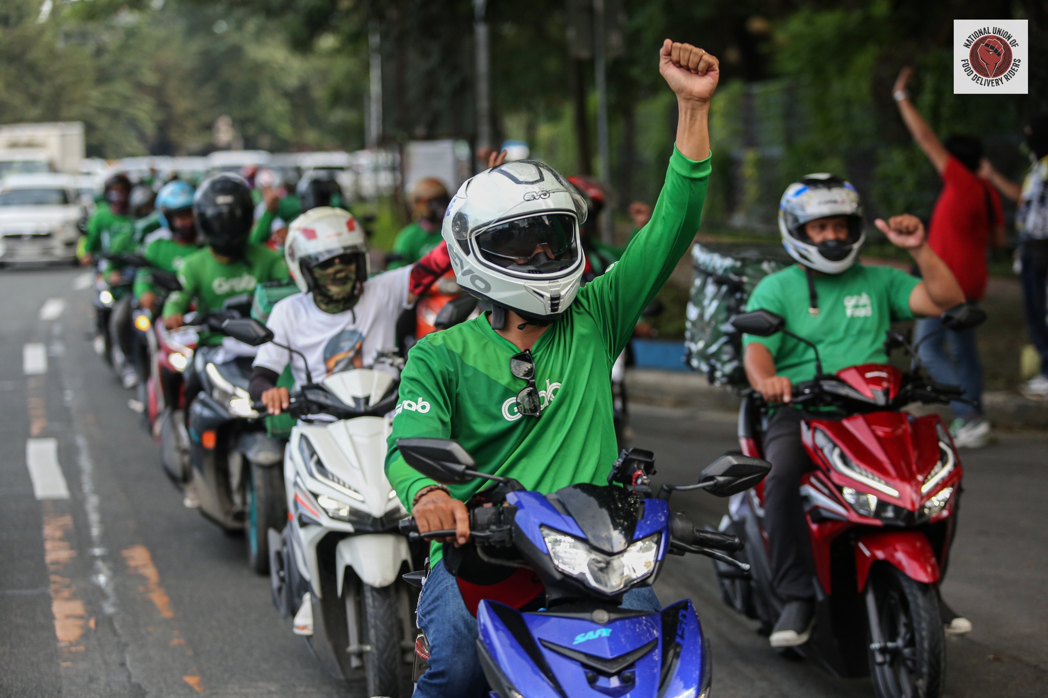 Grab food drivers protest looming base fare reduction