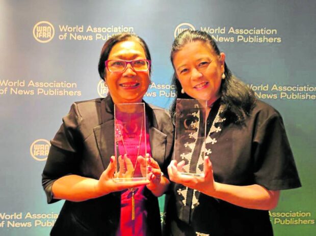 Inquirer Foundation executive director Connie Kalagayan and Inquirer Group of Companies chair Sandy Prieto-Romualdez with the 2023 WAN-Ifra Asian Media Awards trophies 