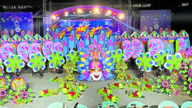 CHAMPION   The dancing contingent from Barangay Granada is the overall champion in the 44th MassKara Festival street dance and arena competition held at Paglaum Sports Complex in Bacolod City on Sunday. —RONNIE BALDONADO/CONTRIBUTOR
