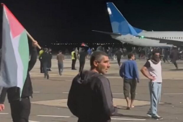 This frame grab taken from video footage posted on the Telegram channel @askrasul on October 29, 2023 shows protestors on the apron area of an airport in Makhachkala. 