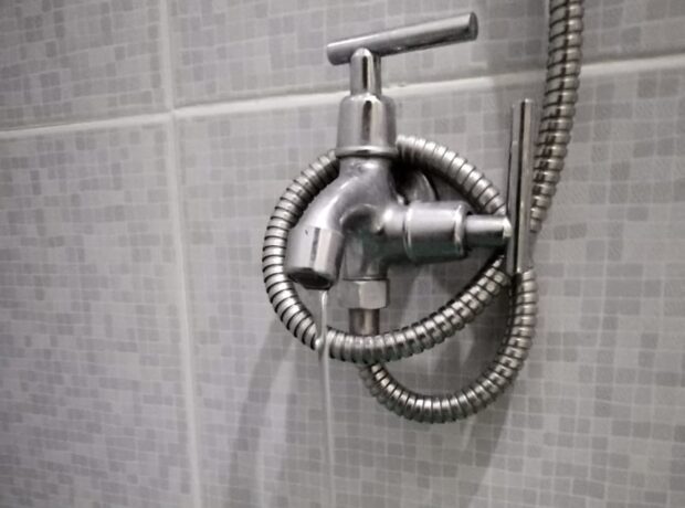 PHOTO: Dripping water faucet in the shower room STORY: PNP to crack down on water pilferage as El Niño looms