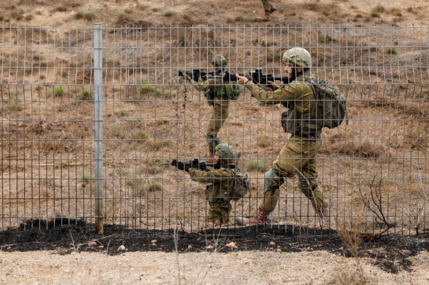 Israel drafts 300,000 reservists as it goes on the offensive
