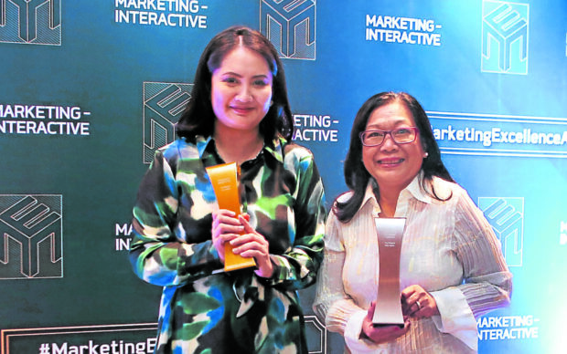 Receiving the Marketing Excellence Awards on behalf of the Inquirer on Friday night are vice president for advertising Kat Dalusong and assistant vice president for corporate affairs Connie Kalagayan.