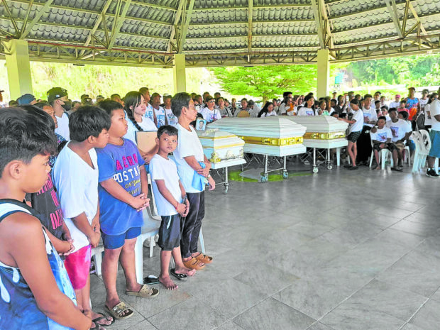 Relatives, neighbors and friends from the village of Calapandayan, Subic, Zambales, attend on Saturday the burial of the three fishermen who died when international oil tanker Pacific Anna rammed into their boat in the waters off Pangasinan province in the West Philippine Sea on Oct. 2. 