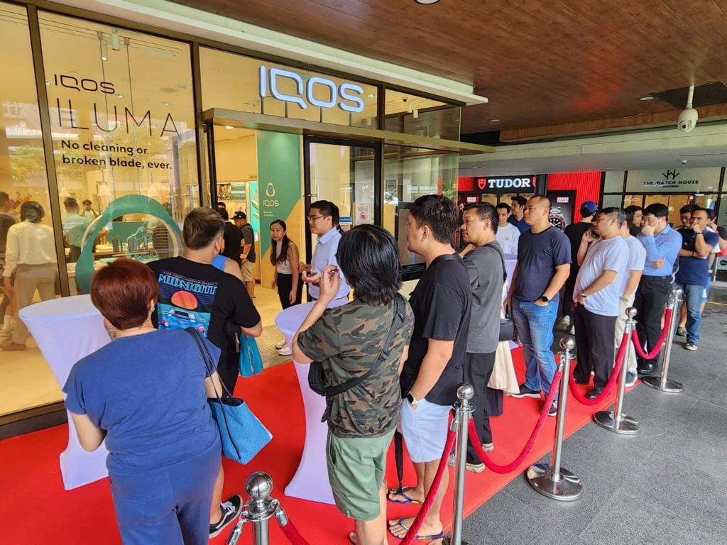 Consumers line up outside the IQOS store in Bonifacio Global City, Taguig to get their hands on IQOS ILUMA, the next-level heated tobacco device from Philip Morris International (PMI) that started exclusively selling today at the BGC High Street outlet.
