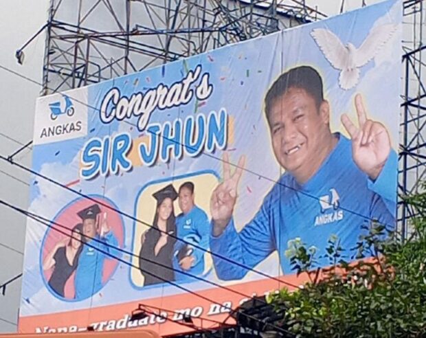 Angkas recognizes biker's achievements with larger-than-life billboard