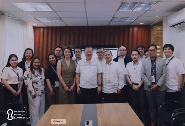 DICT and NPC officials sign a memorandum of agreement for a digital security and privacy project (Photo from NPC website)